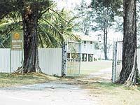 The Istana Pantai building seen from the entrance gate.