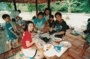 Guests savouring their own cooked lunch by the Kiulu river at the Tamparli and Tuaran Spice and Cooking Tour, Sabah, Malaysia Borneo